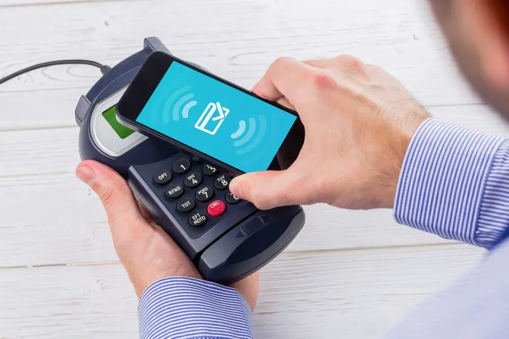 Wifi connection against man using smartphone to express pay